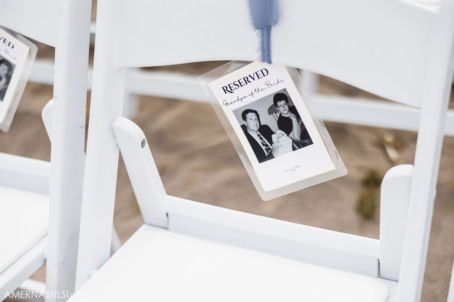 Polaroid photos hanging from strings creating a rustic wedding photo display.