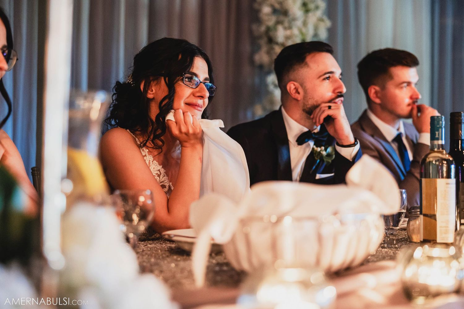 Wedding couple sharing a candid moment during their reception dinner.