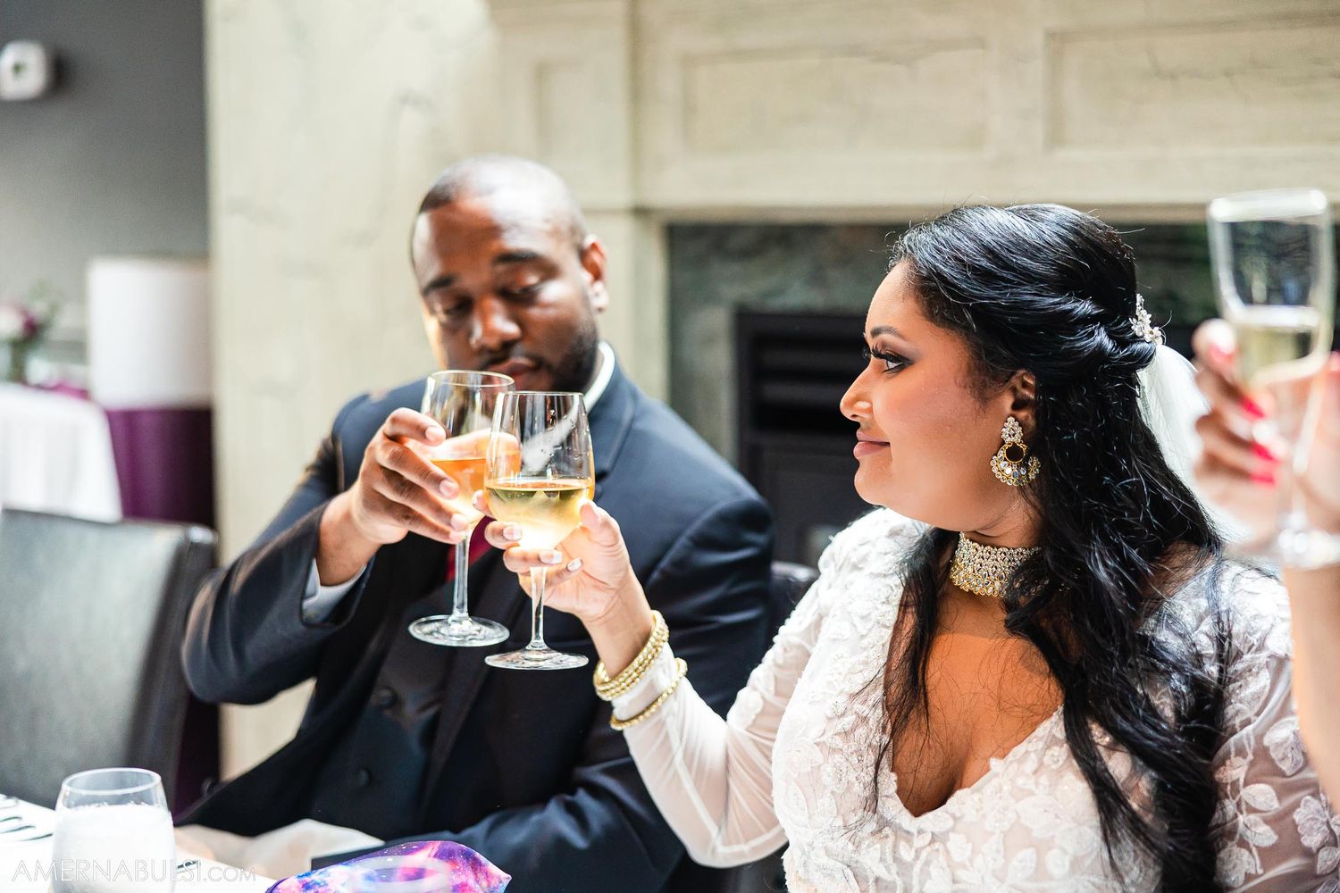Celebration scene with champagne toast at an elegant reception table.