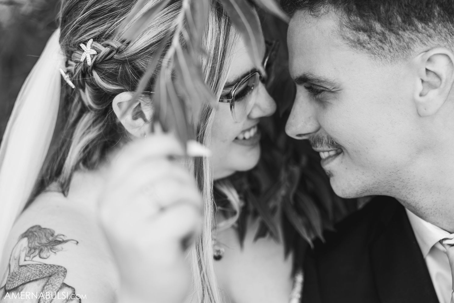 Intimate black and white portrait shots of newlyweds sharing tender moments.
