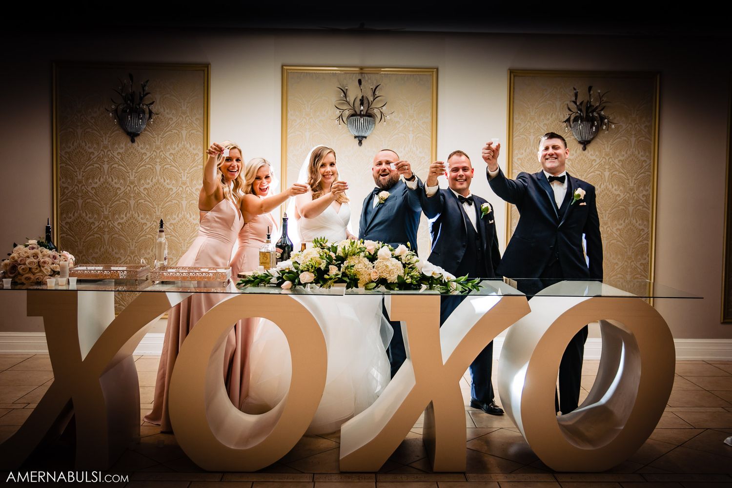 Decorative wooden letters spelling out text at a wedding reception venue.