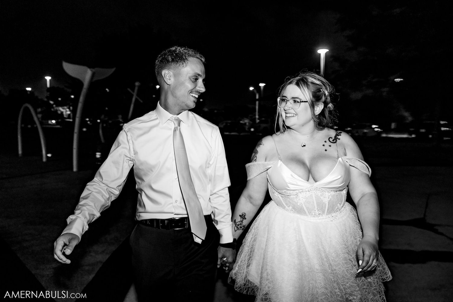 Black and white wedding reception dance floor captures romantic dancing moments in an elegant venue.