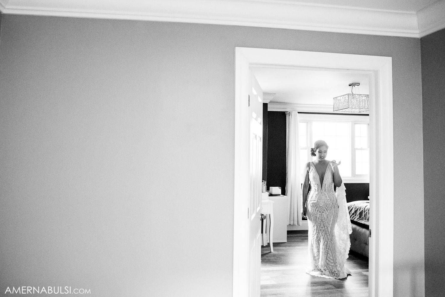 Minimalist black and white architectural interior hallway with dramatic lighting and shadows.
