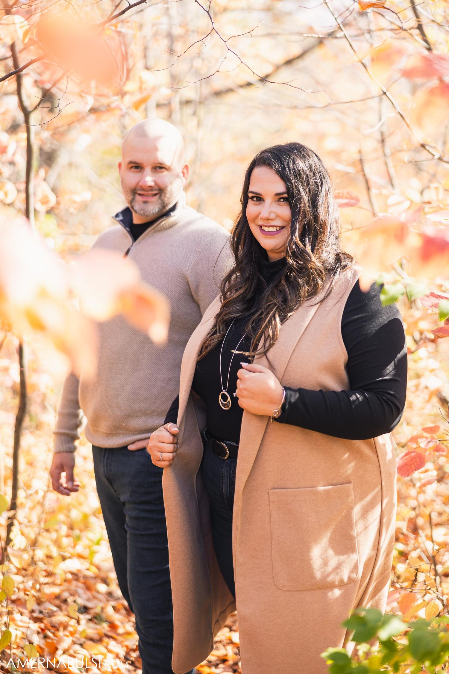 Autumn portrait in woods with golden leaves and natural light.