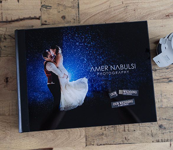 Professional wedding photo album spread featuring dramatic blue lighting effects.