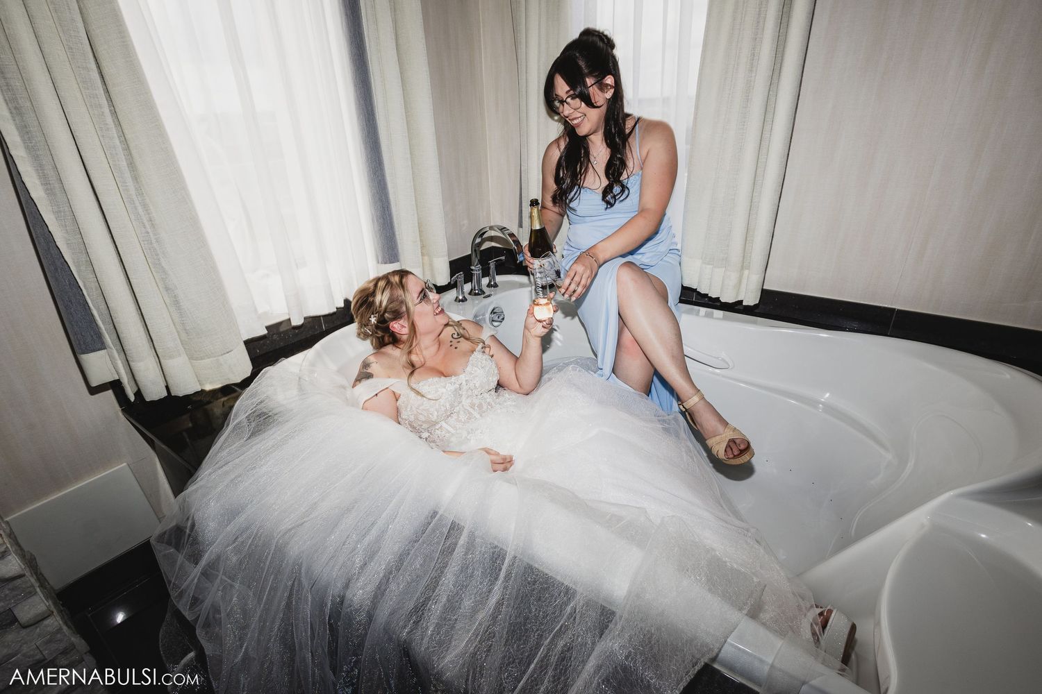 Close-up shots of a white wedding dress being adjusted and fastened.