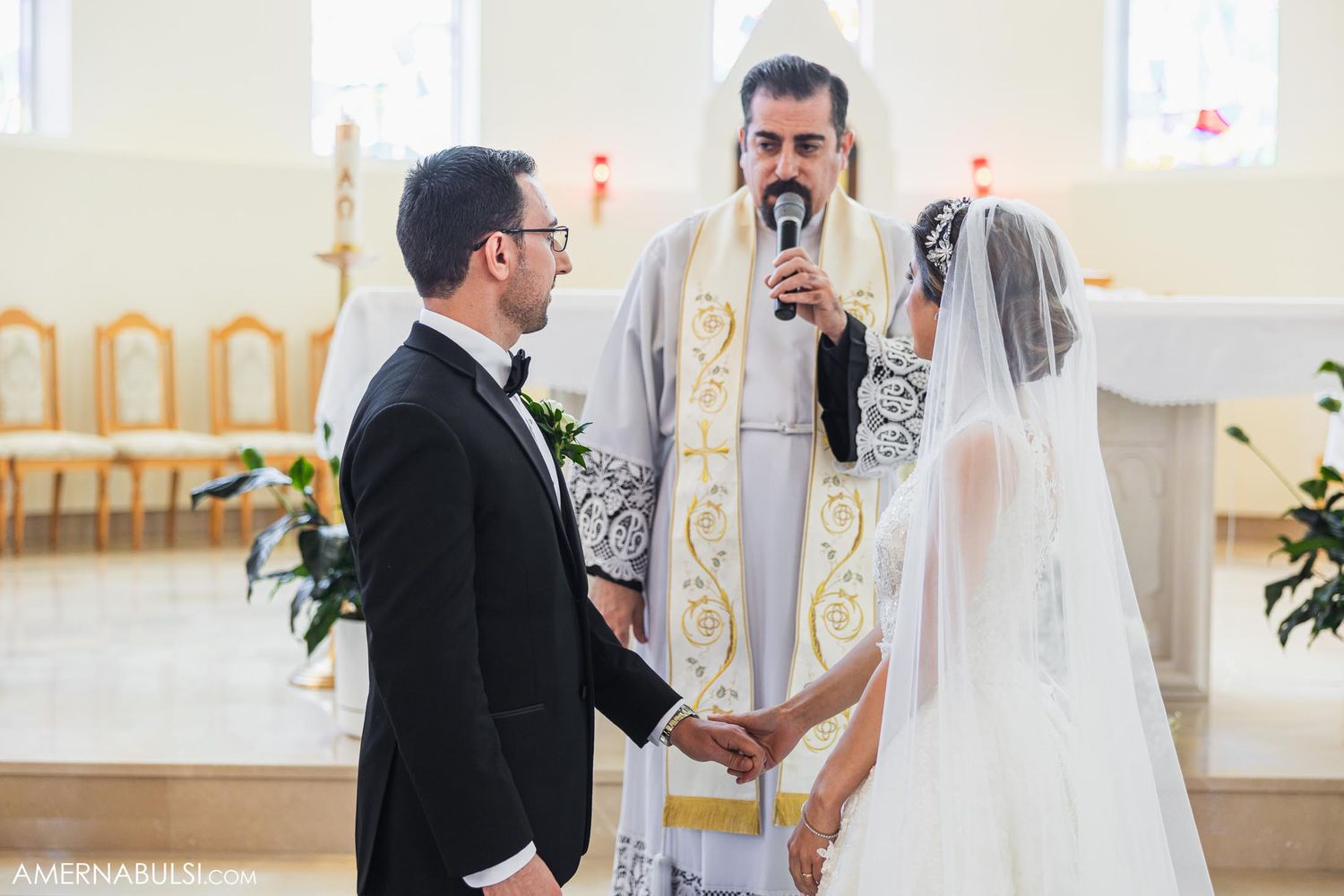 Traditional wedding ceremony taking place in a bright church interior.