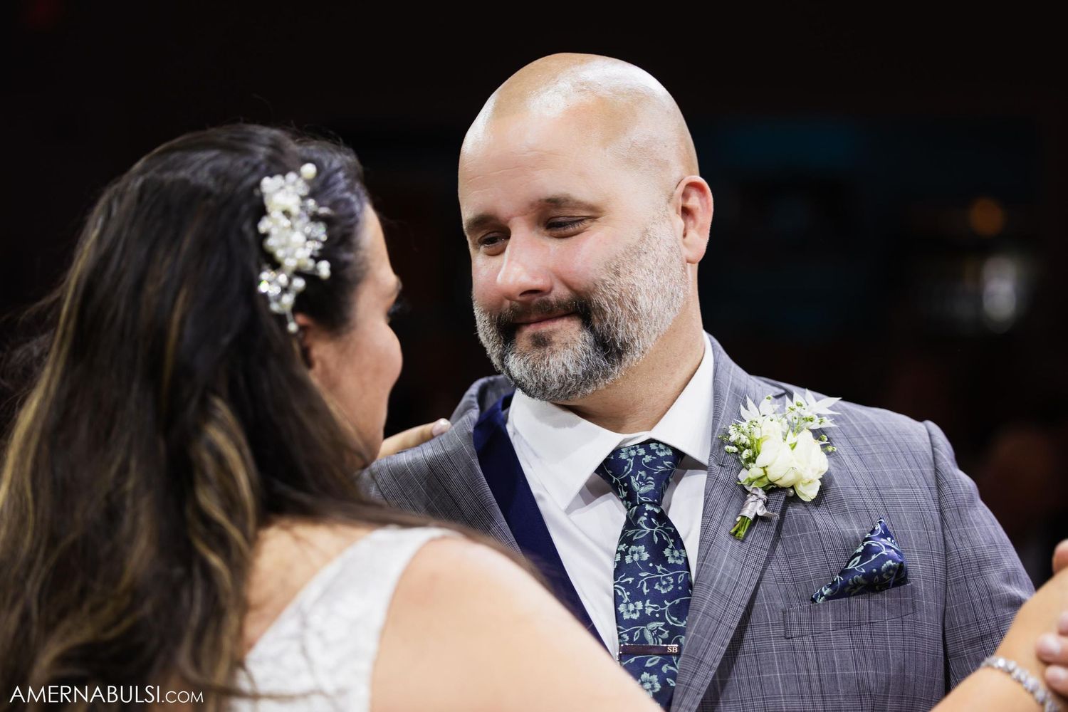 A close-up shot of a tender moment between newlyweds during their first dance.