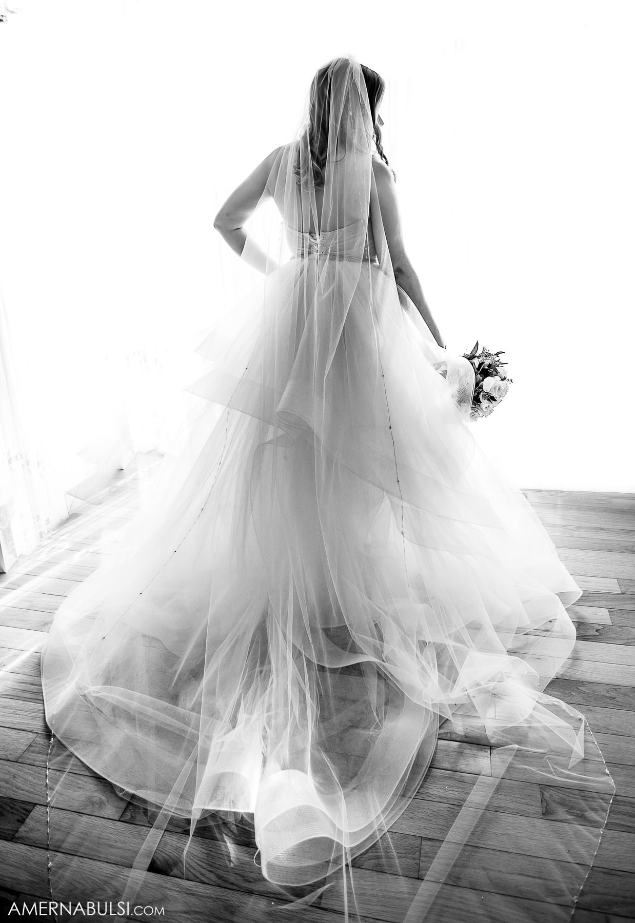Series of ethereal shots showing flowing white wedding dress movement across wooden floor.
