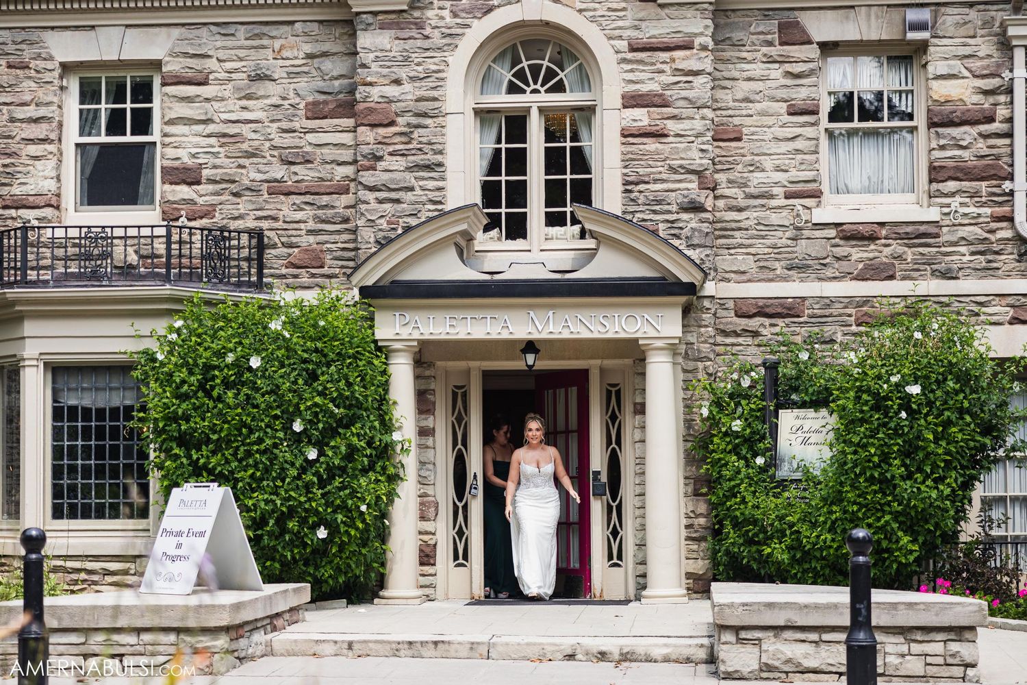 Grand stone building entrance with arched doorway and architectural details.