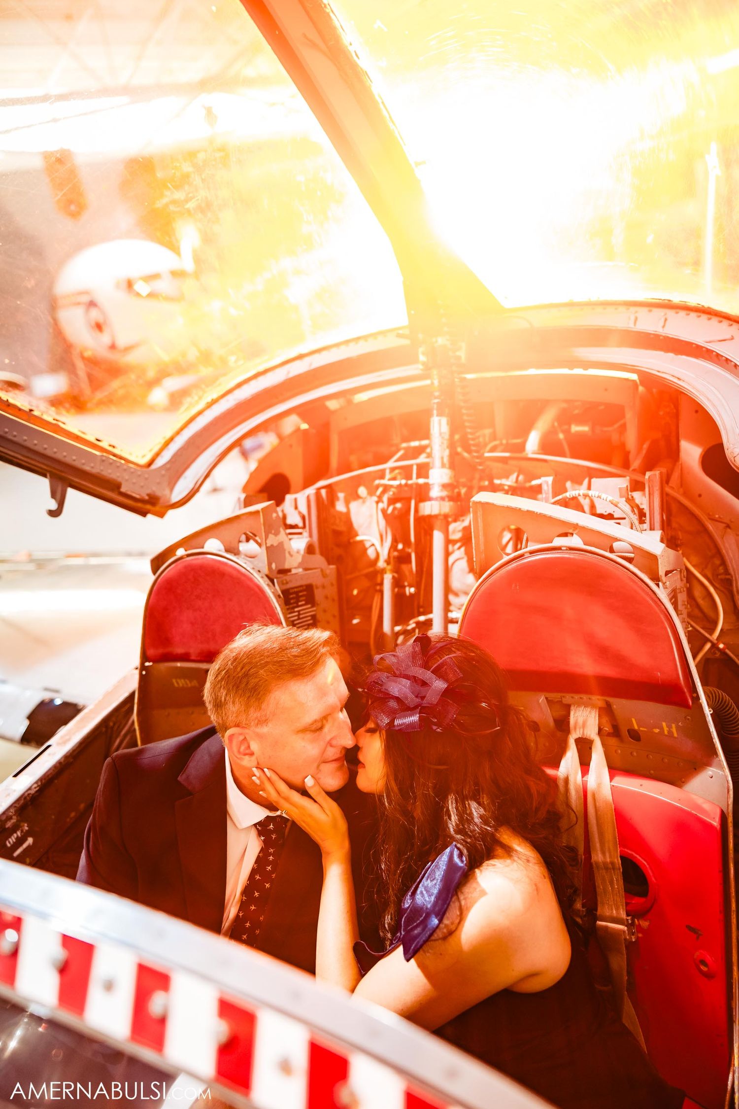 Sunlit interior of aircraft cockpit during romantic photoshoot.