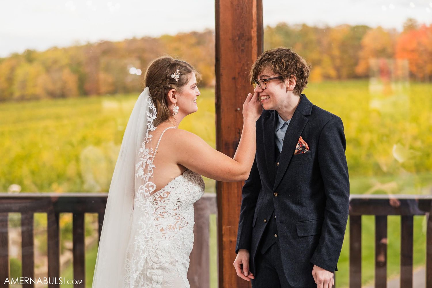 An emotional moment shared between the couple during their autumn outdoor wedding ceremony.