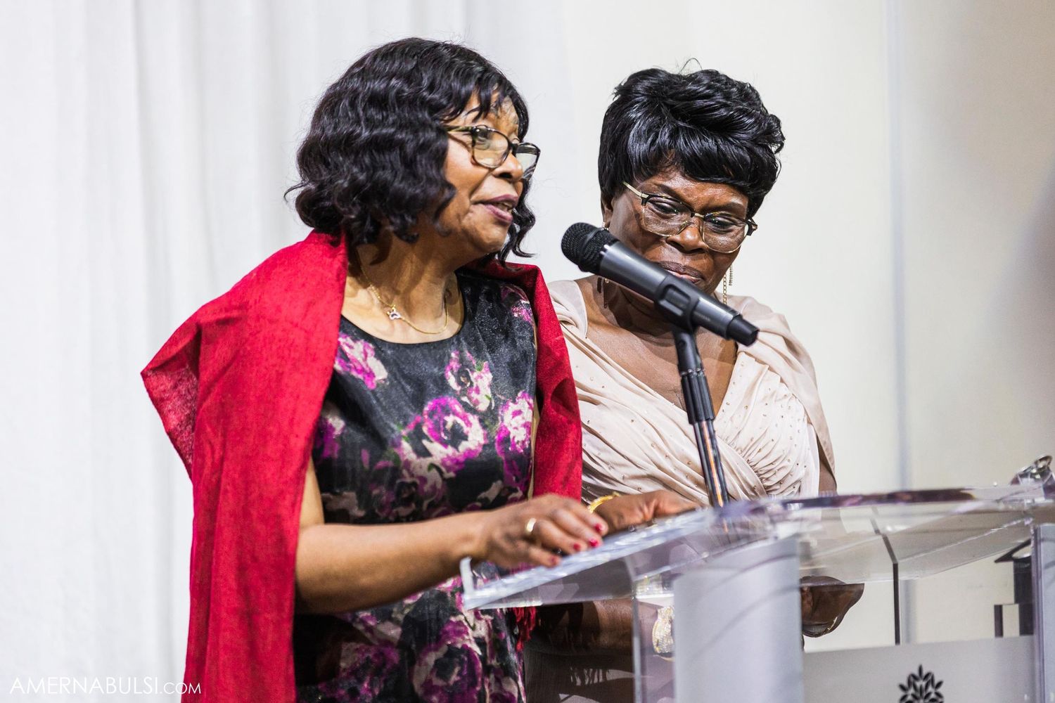 Emotional reactions captured during wedding speeches at an elegantly decorated reception.