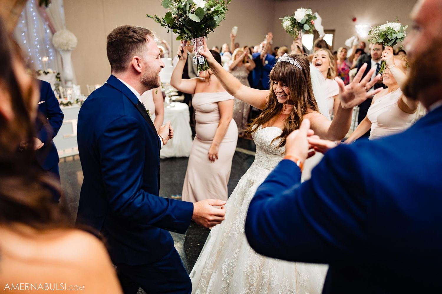 Wedding reception dance floor filled with celebration and dancing.