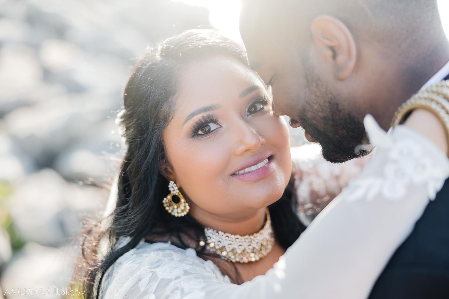 A tender close-up moment between newlyweds on their wedding day in natural light.