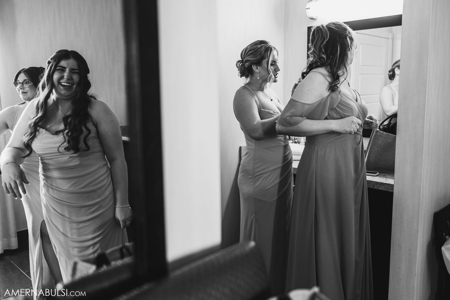 Black and white candid shots showing people getting ready in an interior space with soft lighting.