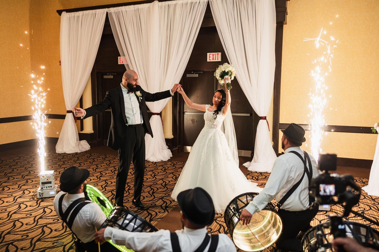Wedding celebration with cold sparklers and live band performing.