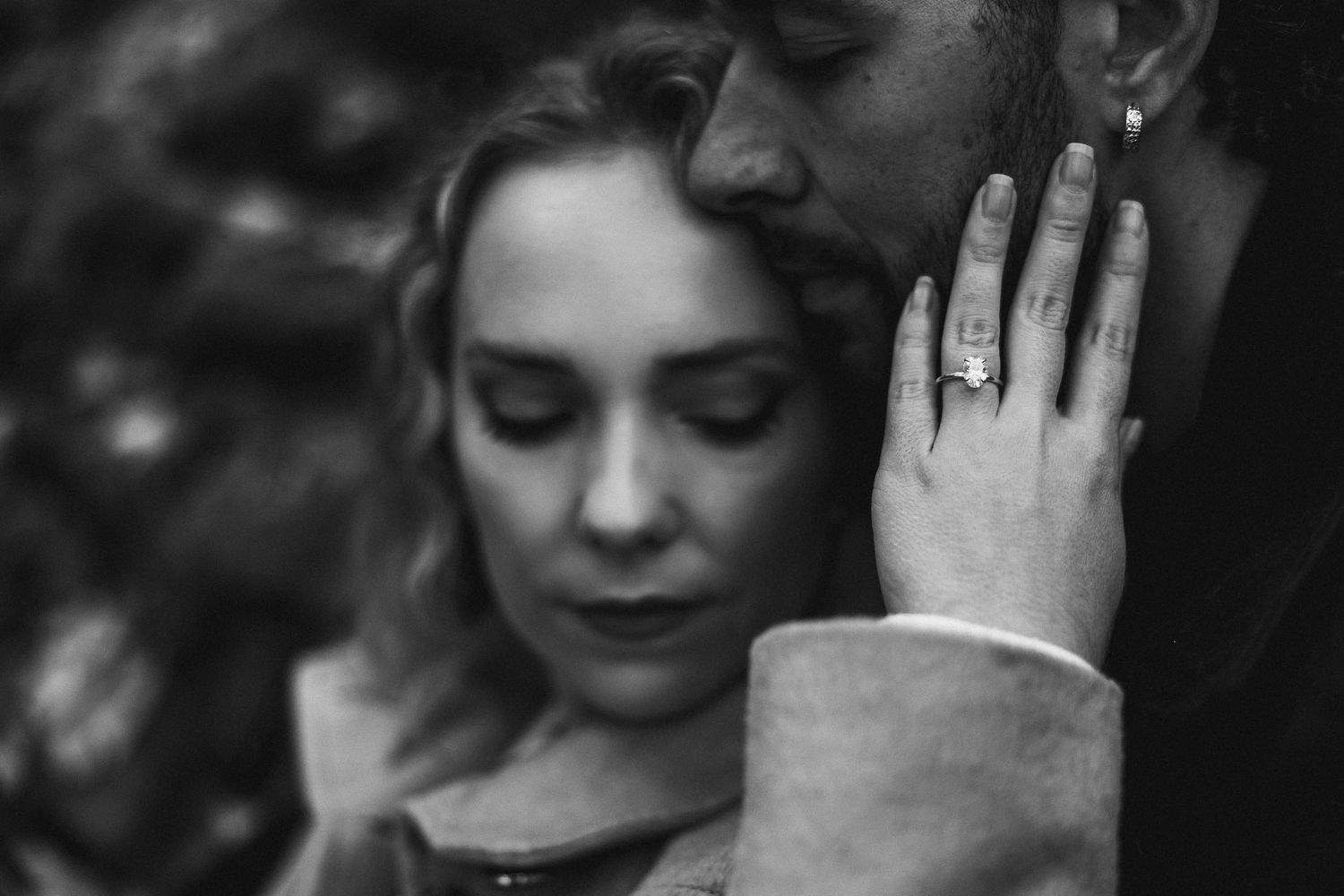 Black and white portrait of a tender romantic moment between two people.