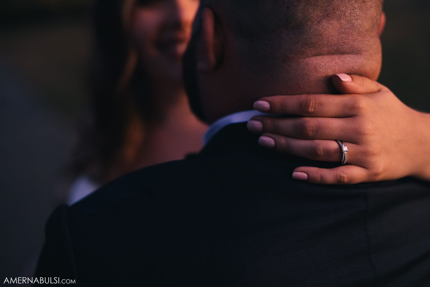 Dark silhouettes of wedding guests during an evening reception.
