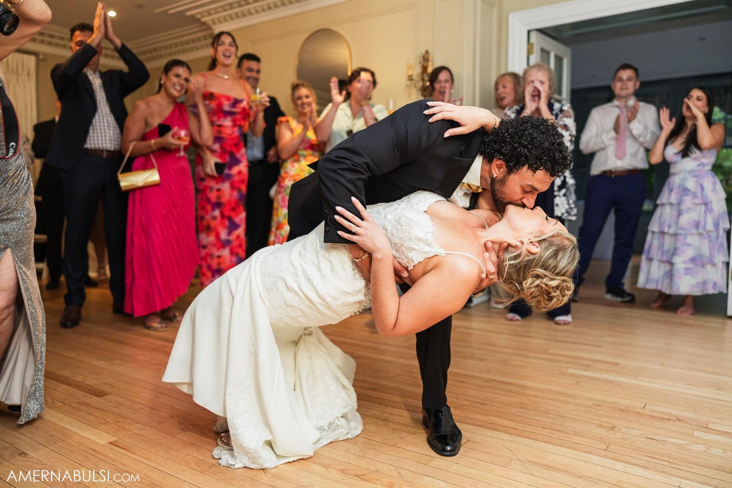 Romantic dip during first dance at wedding reception.