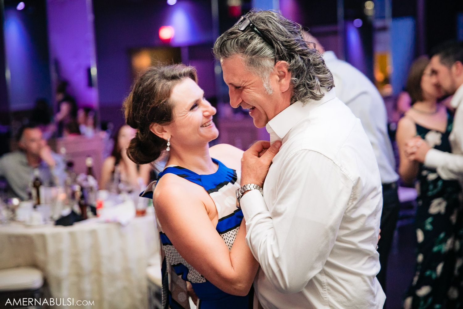 A series of wedding dance photos showing tender moments between a couple on the dance floor with purple lighting.