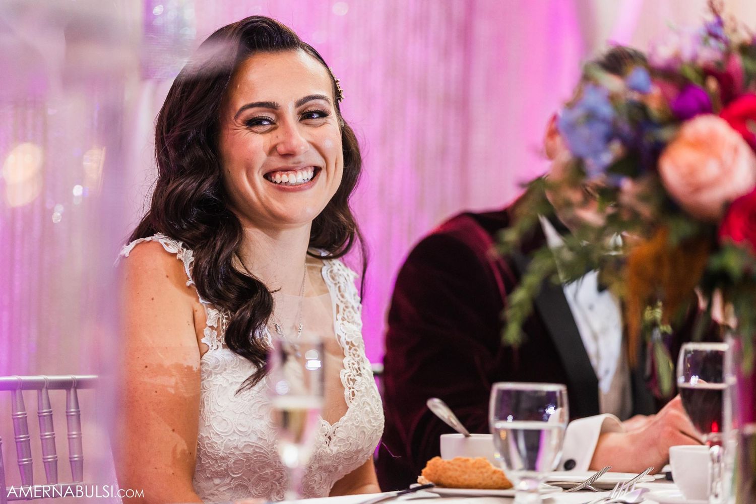 Elegant wedding reception scene with beautiful decor and floral arrangements.