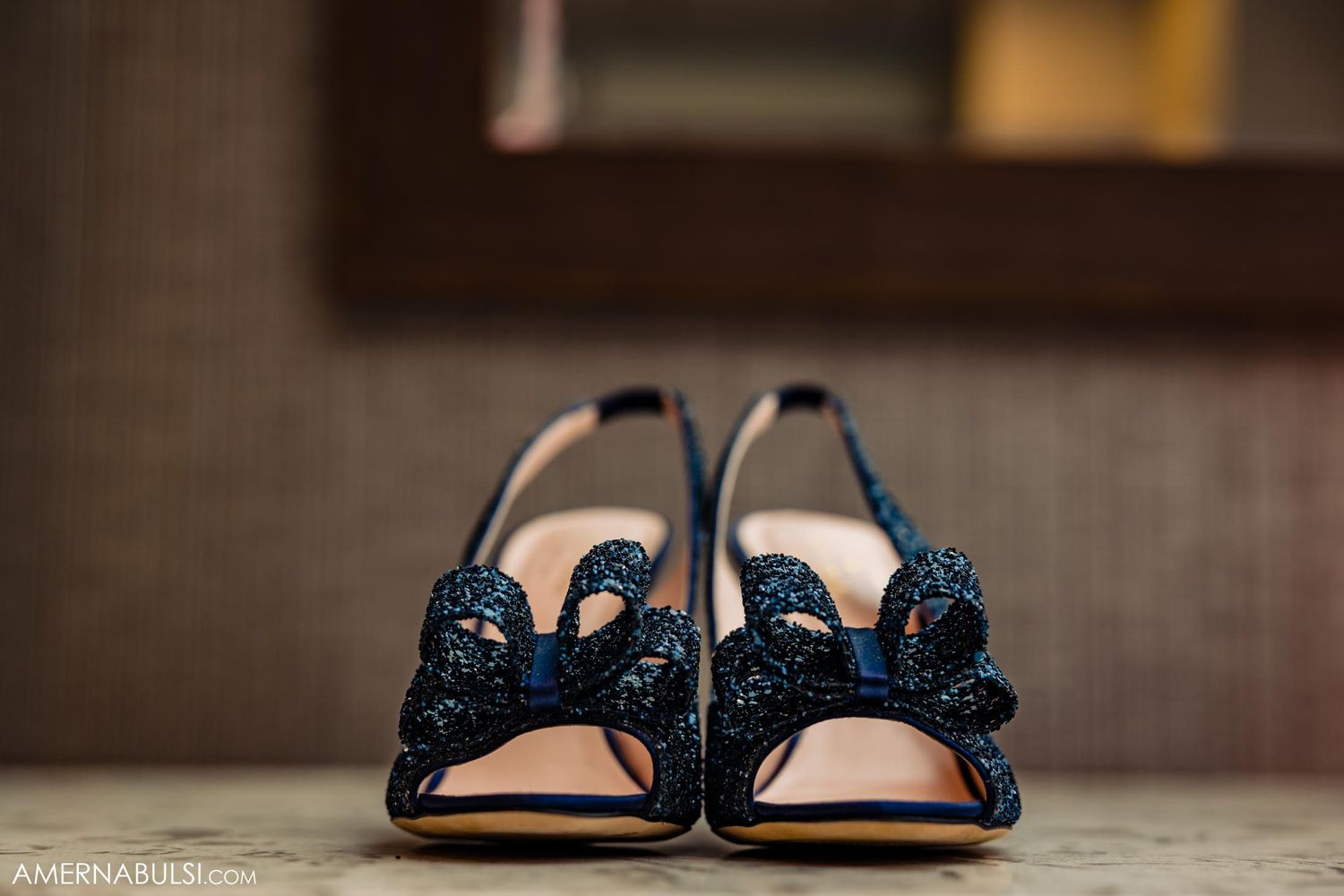 Elegant navy blue embellished bridal shoes photographed in detail.