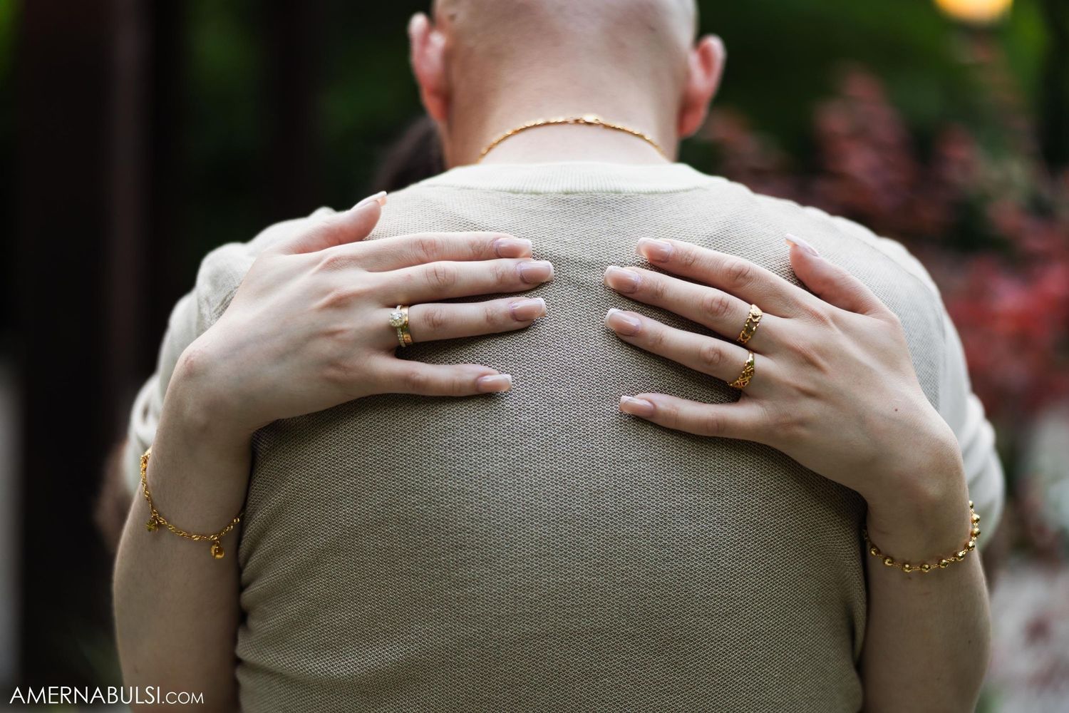 Close-up of hands embracing during an intimate wedding moment.