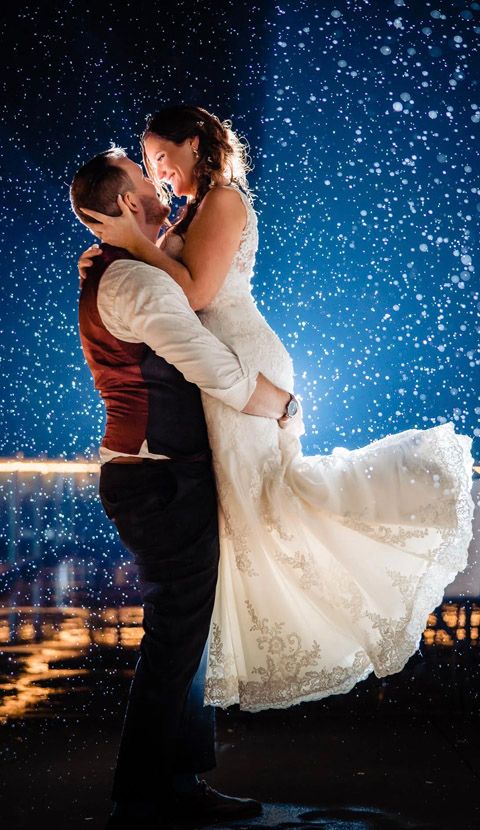 Romantic wedding couple silhouetted against starry night sky in dramatic dip pose sequence.