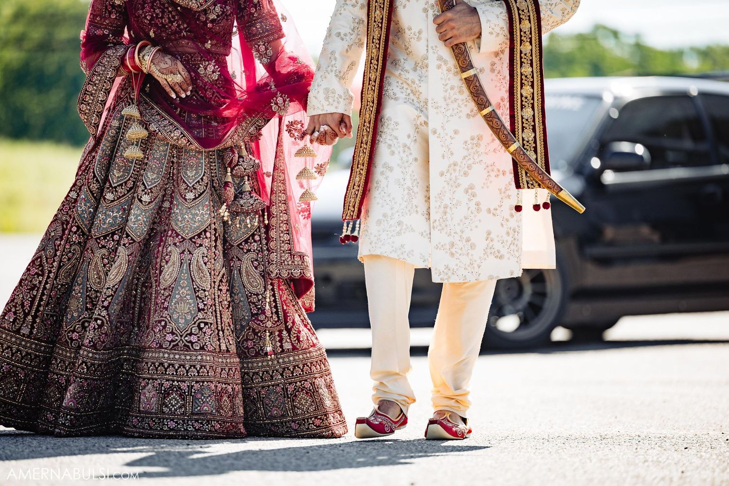 Close-up of traditional Indian wedding attire showing detailed embroidery and fabric work.