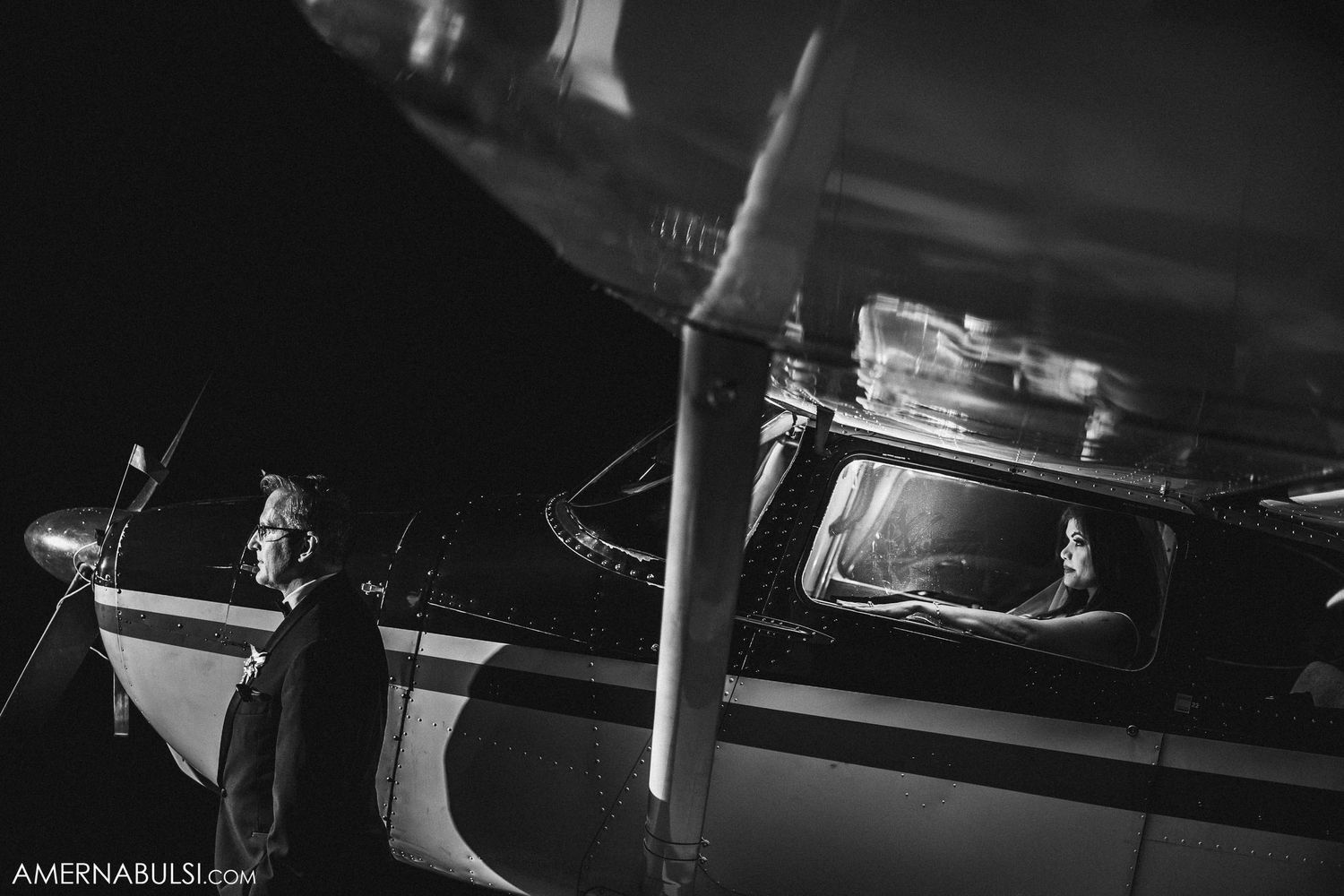 Artistic black and white photo of aircraft details at night.
