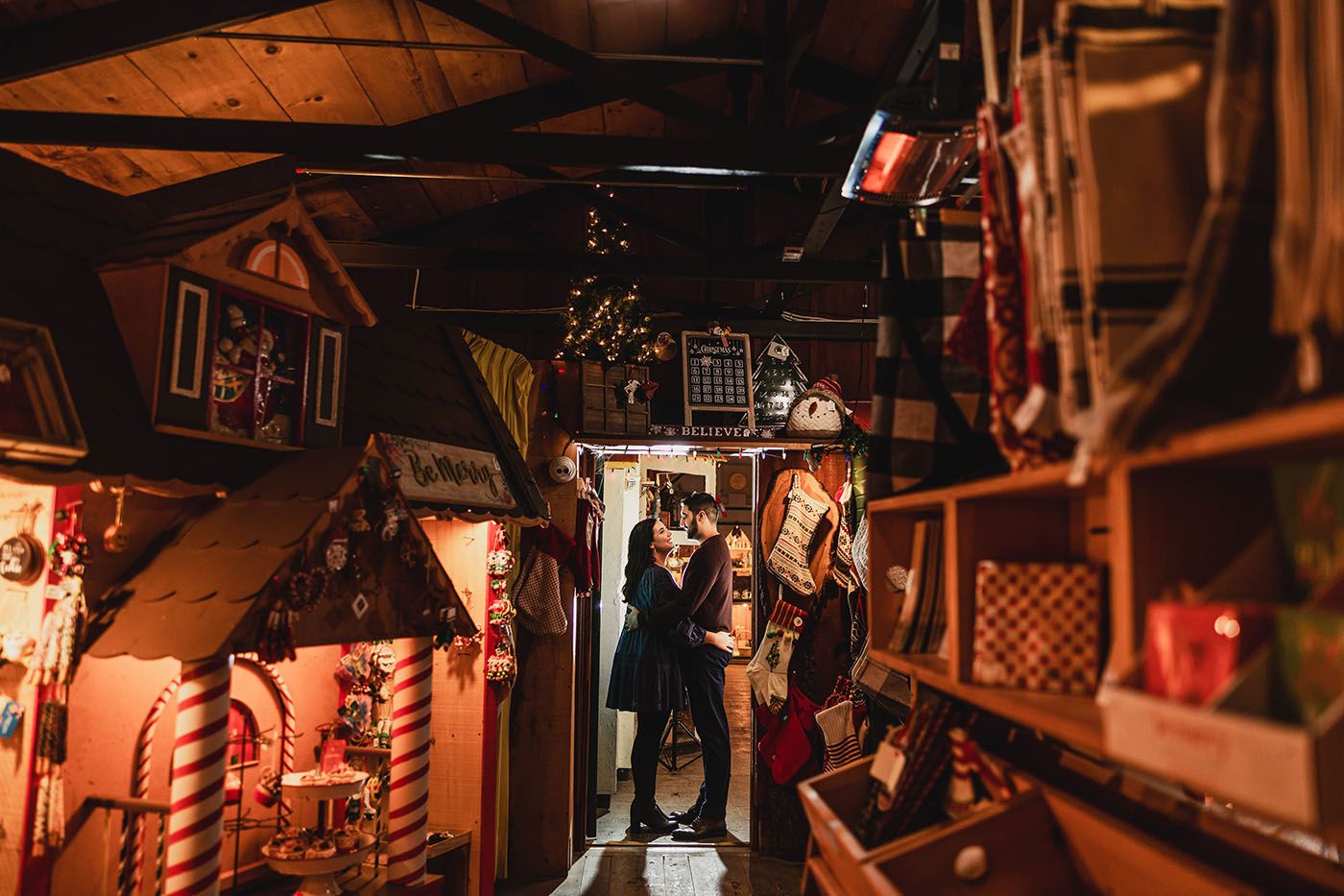 Cozy bar interior with warm lighting and rustic wooden decor.