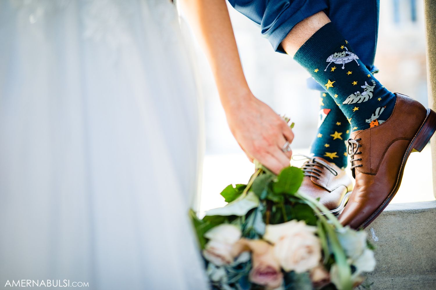 Wedding details featuring blue and white floral arrangements with delicate ribbons and decorative elements.
