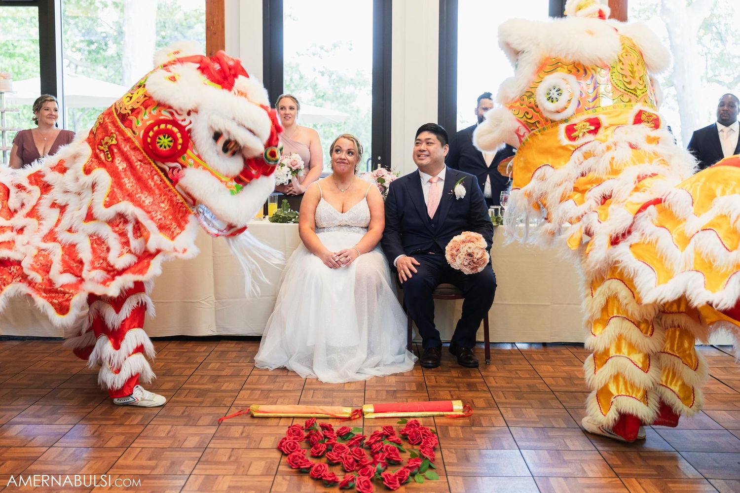 Lion dance performers flank newlyweds during traditional Chinese wedding celebration.