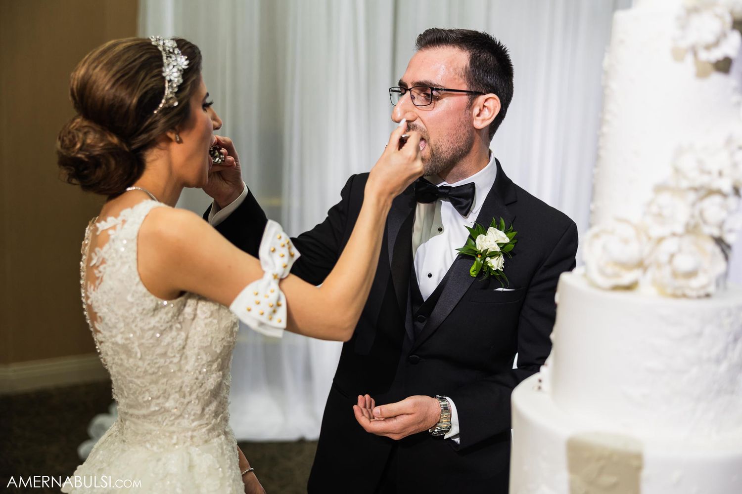 A candid moment showing a tender interaction between newlyweds during their wedding celebration.