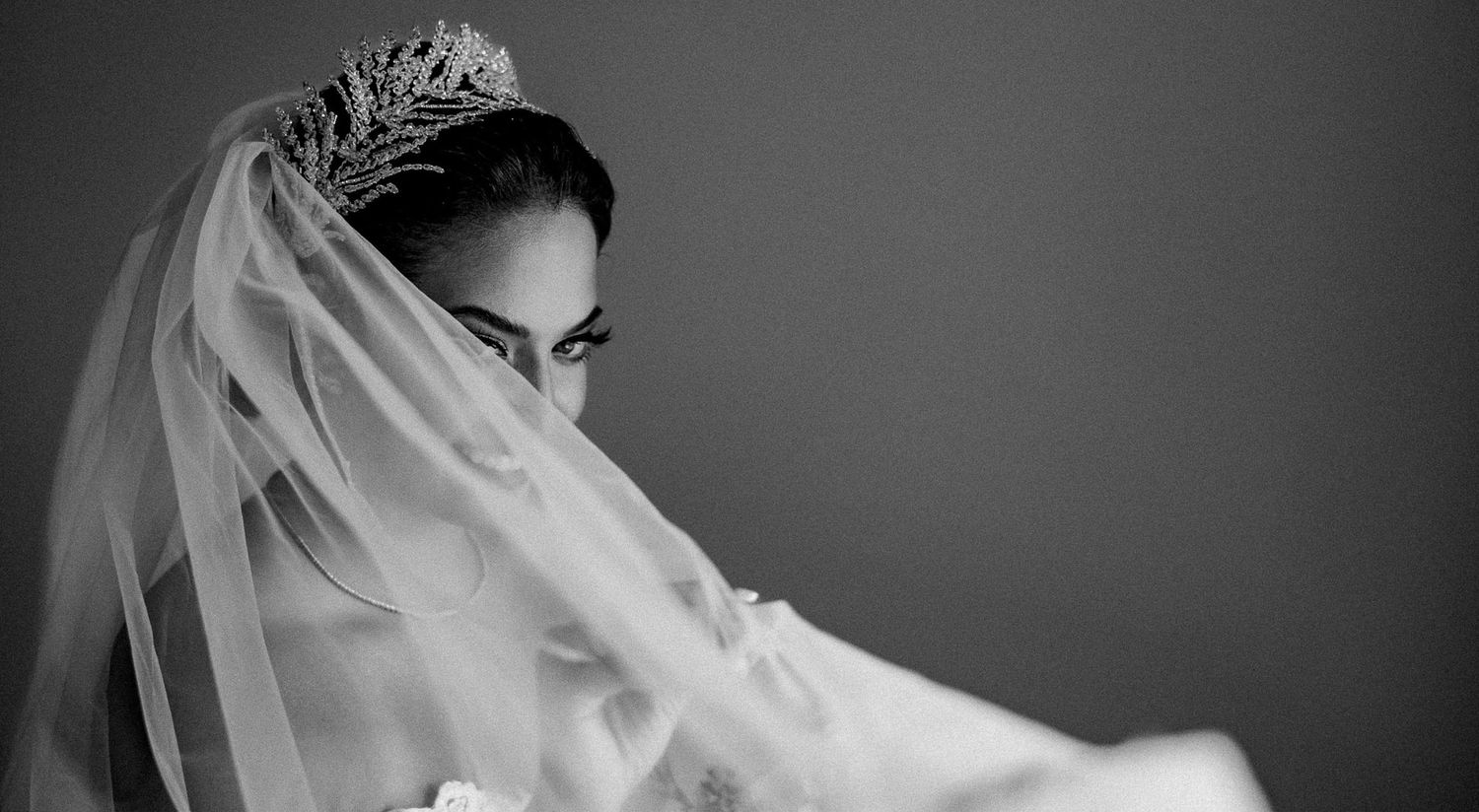 Artistic black and white bridal portraits with dramatic lighting and veil details.