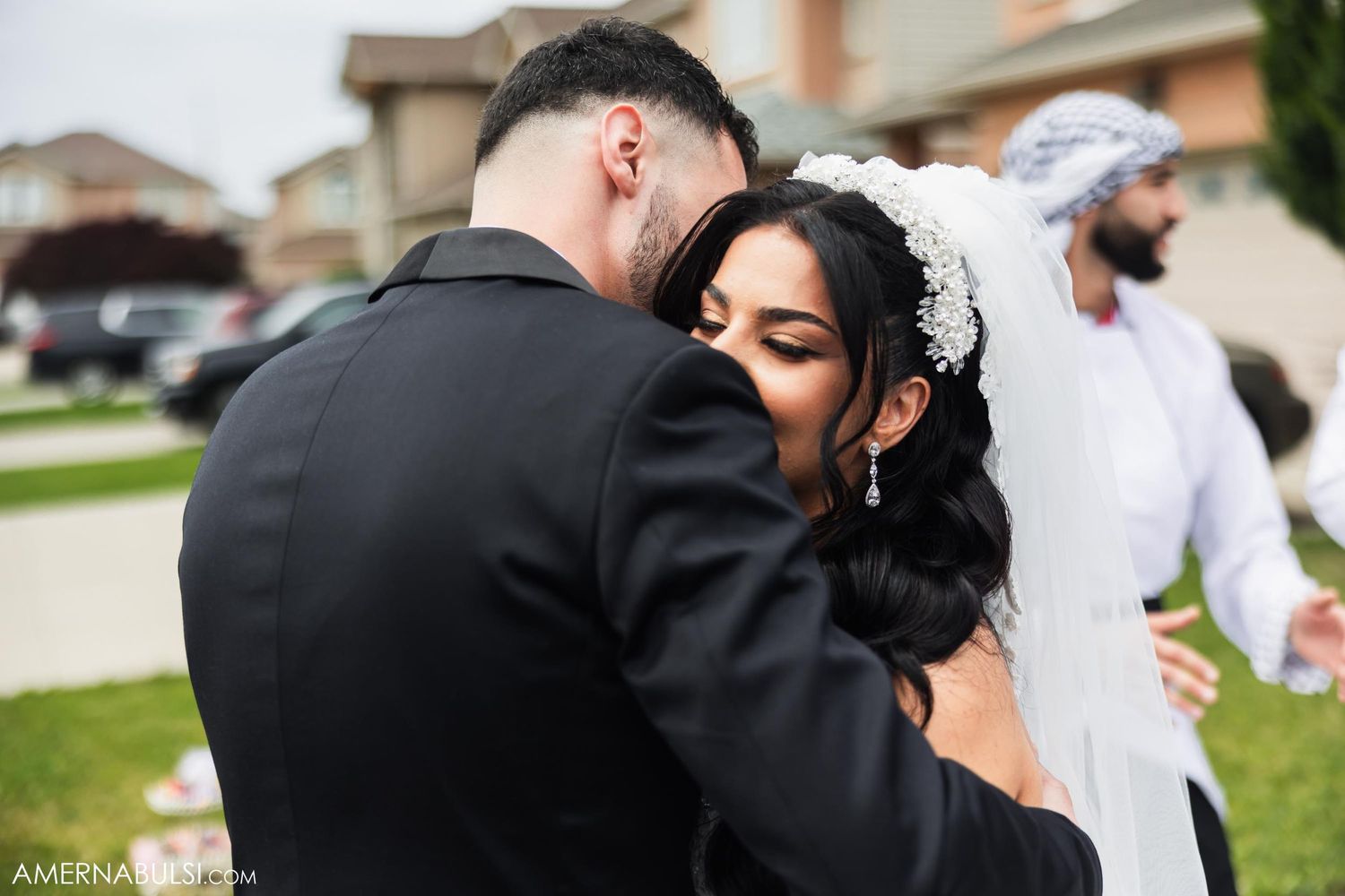 A bride and groom embrace during an emotional first look before their wedding ceremony.
