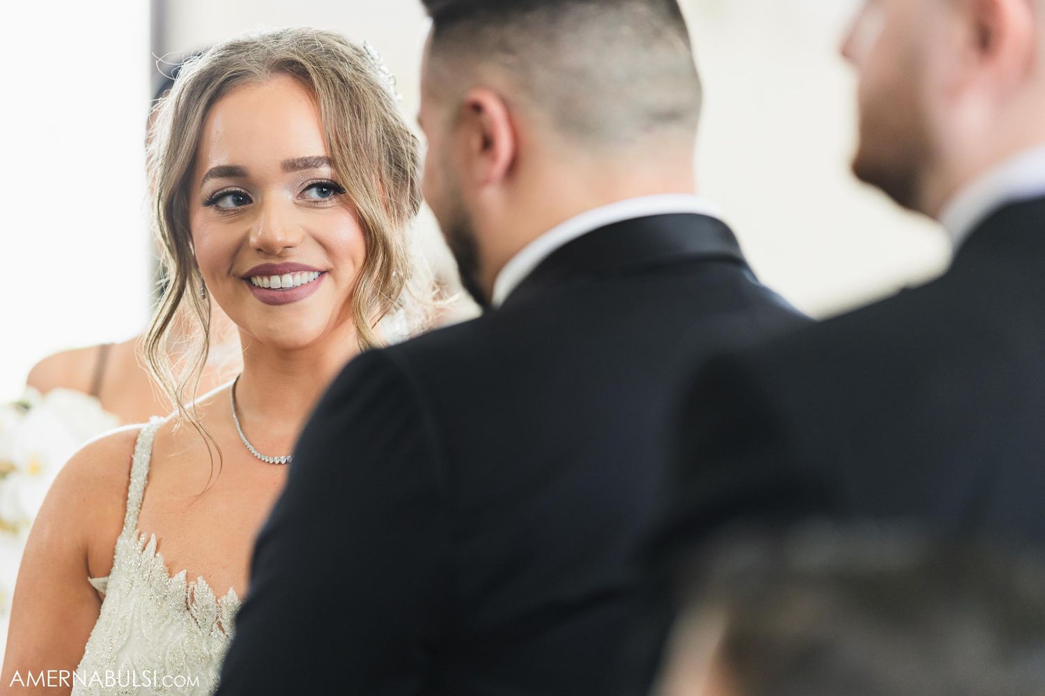 Candid emotional moment during traditional church wedding ceremony.
