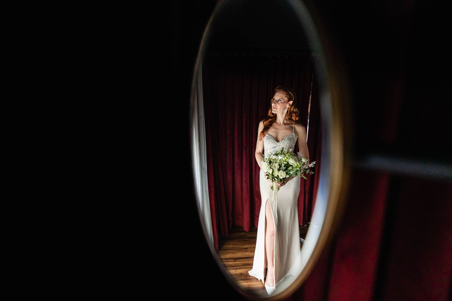 Artistic framed mirror shots of bride in wedding dress.