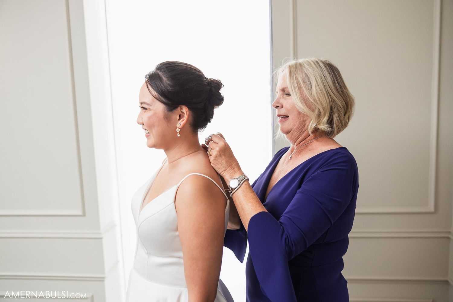 A heartwarming getting-ready moment shows final wedding day preparations.