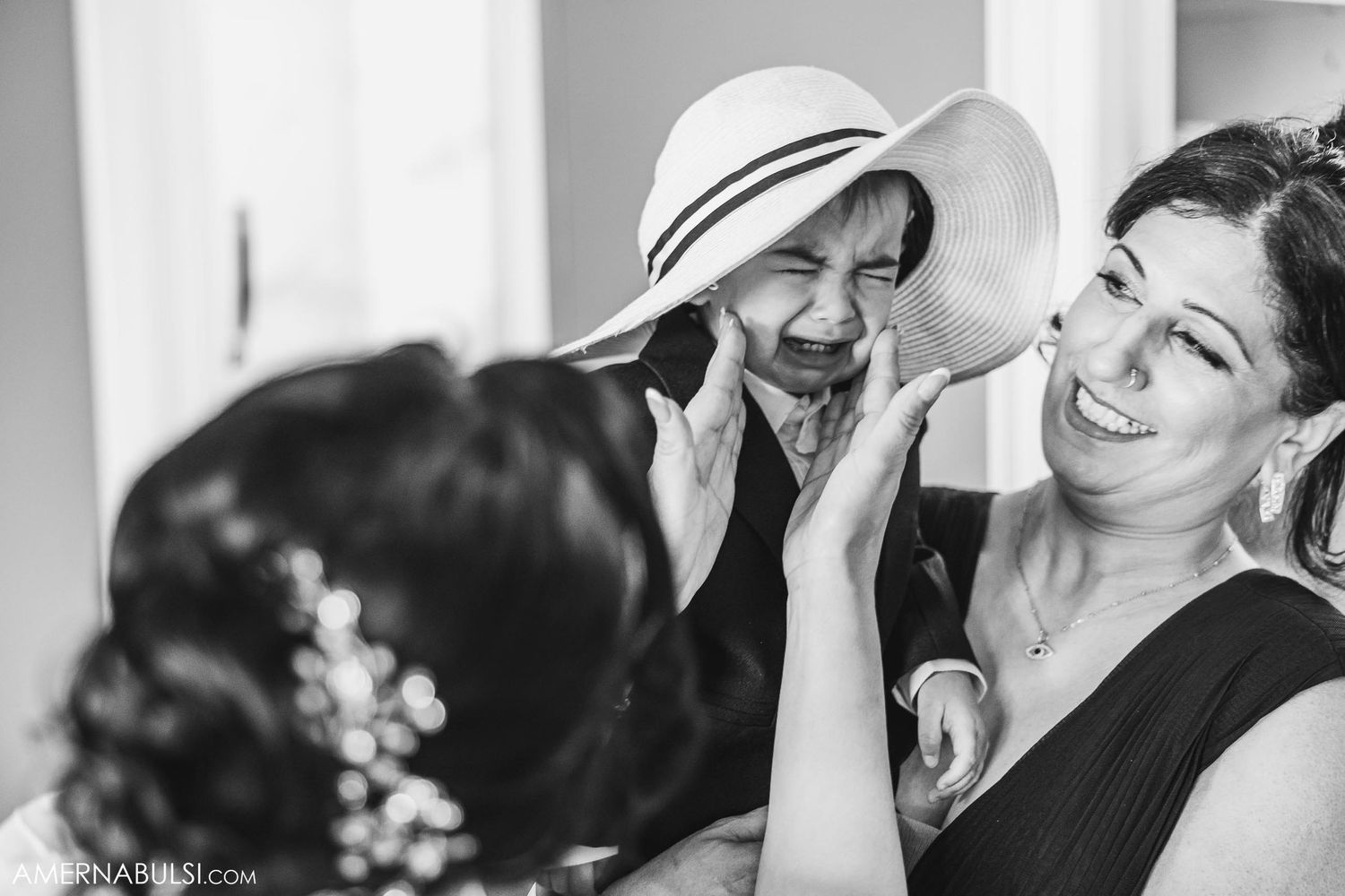 A heartwarming moment shared between people during wedding day preparations.