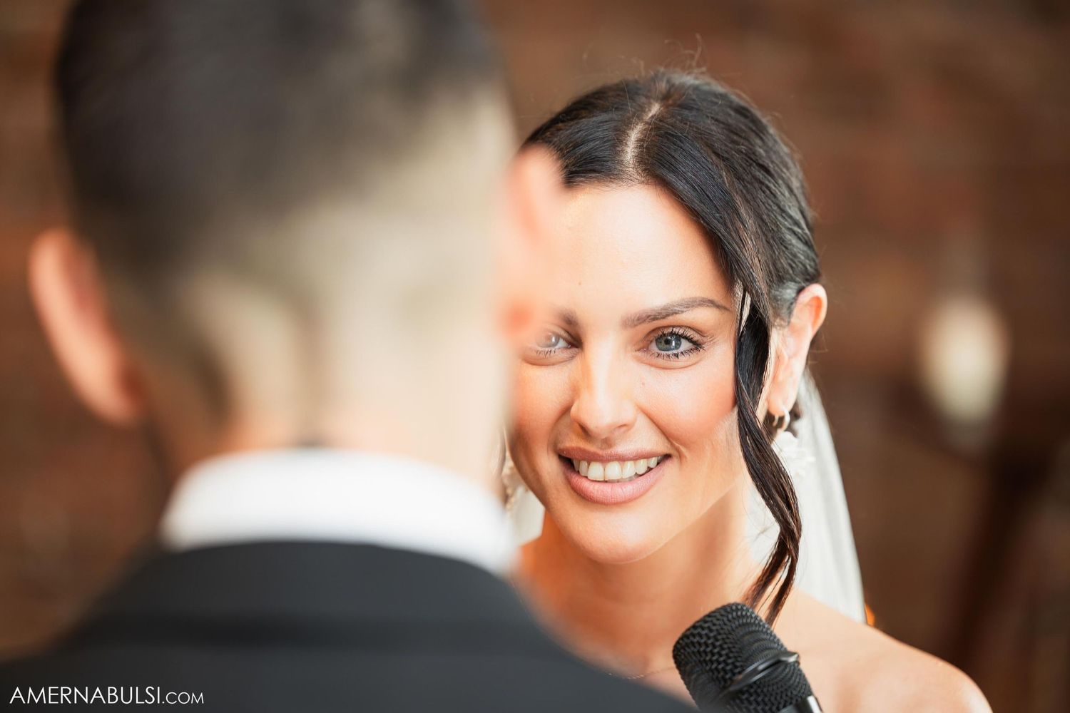 A candid moment of joy captured during formal wedding photography.