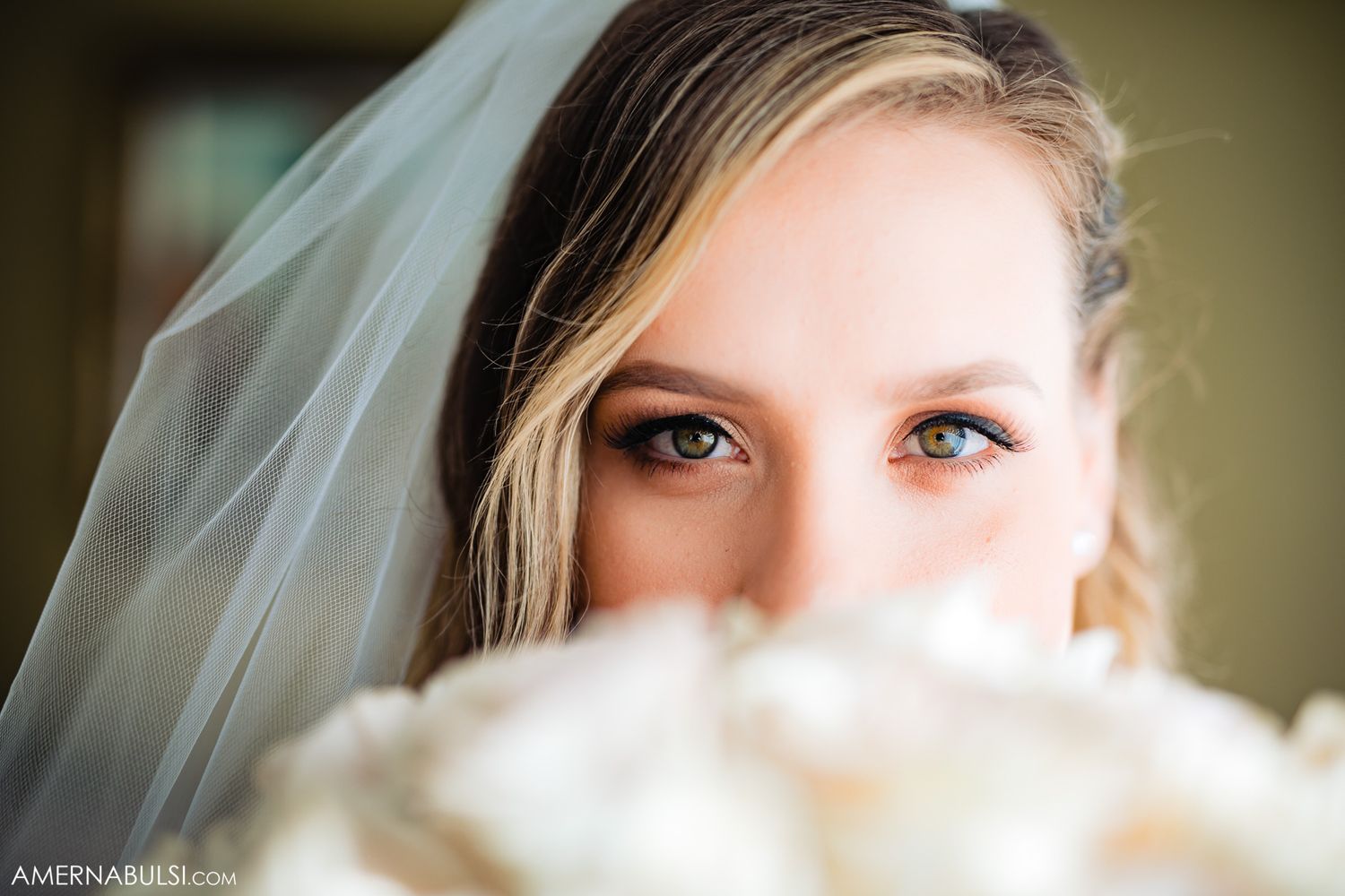 Artistic close-up shots focusing on bridal details and veil.