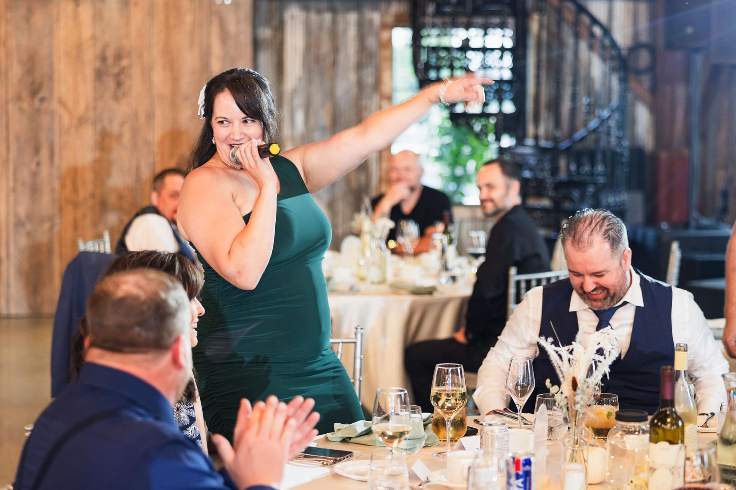 A person gives an emotional toast during a wedding reception dinner.