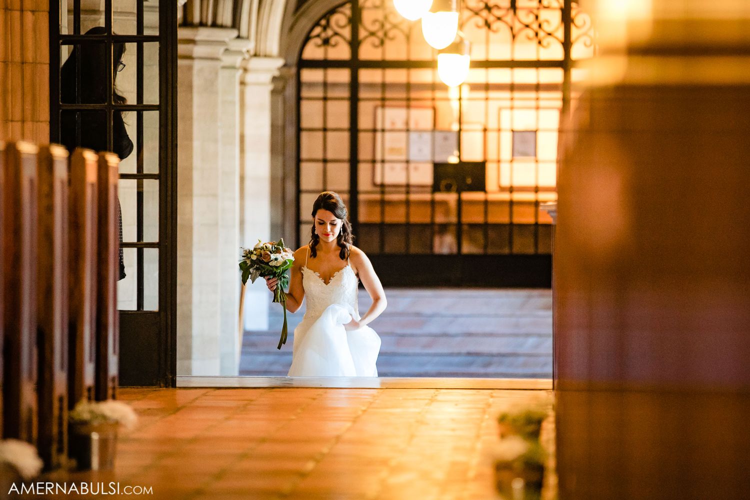 Romantic wedding ceremony scene with sunlight streaming through gothic windows.