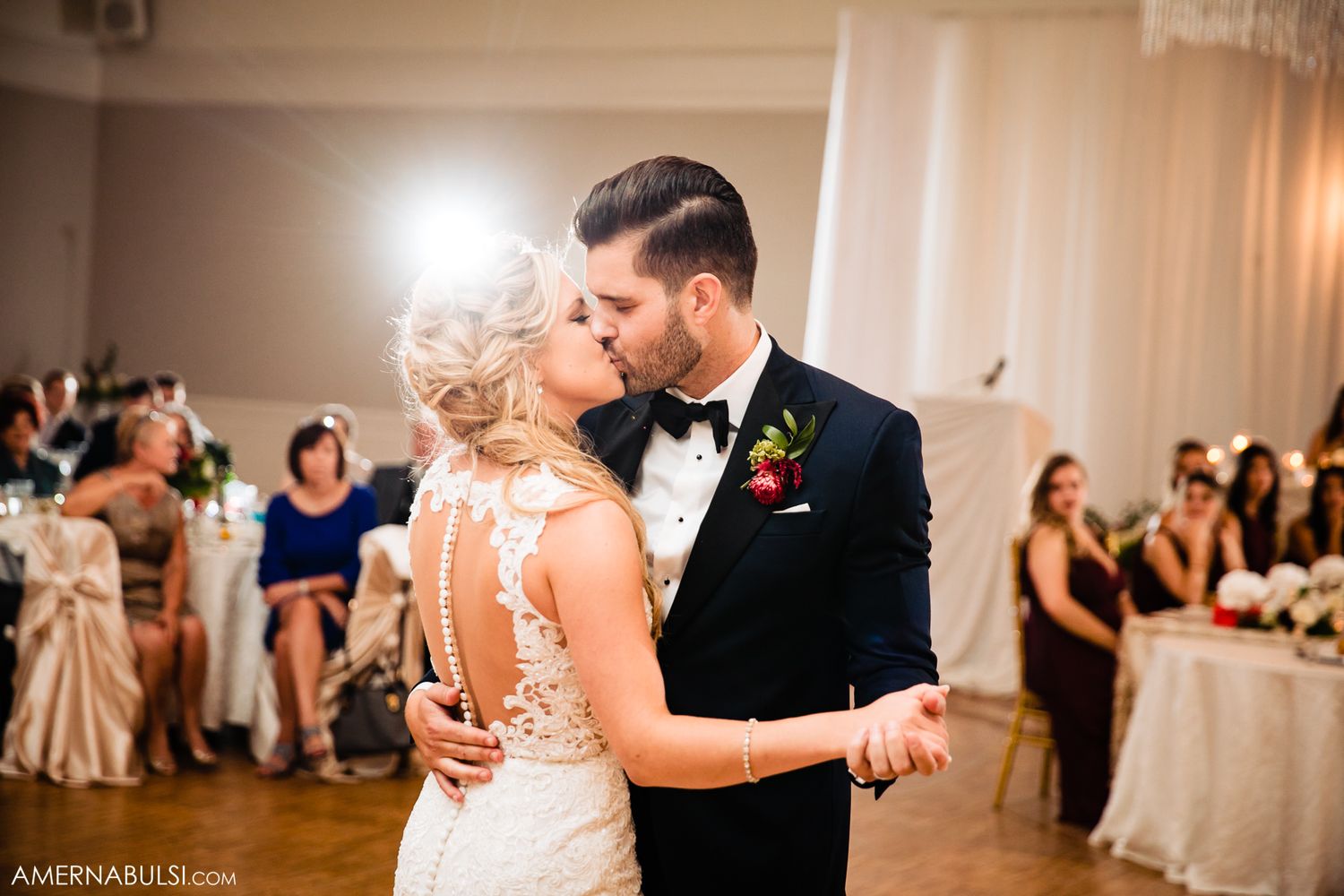 Romantic wedding dance sequence showing couple twirling and embracing in an elegant ballroom setting.