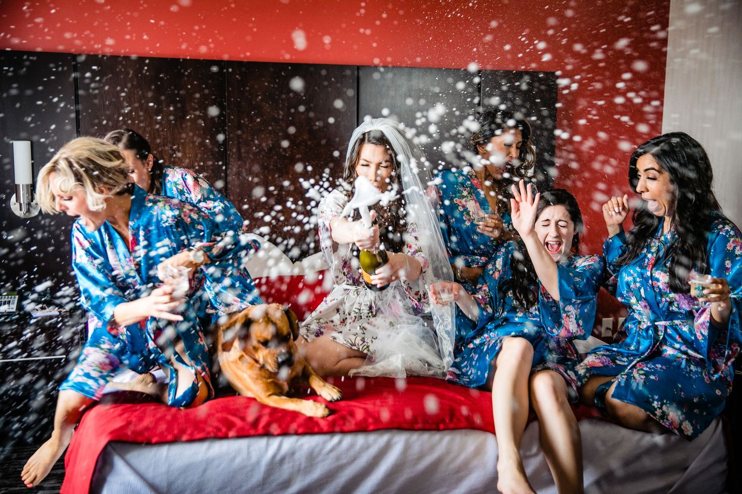 Celebratory scene with red and blue confetti flying through the air during festive moment.