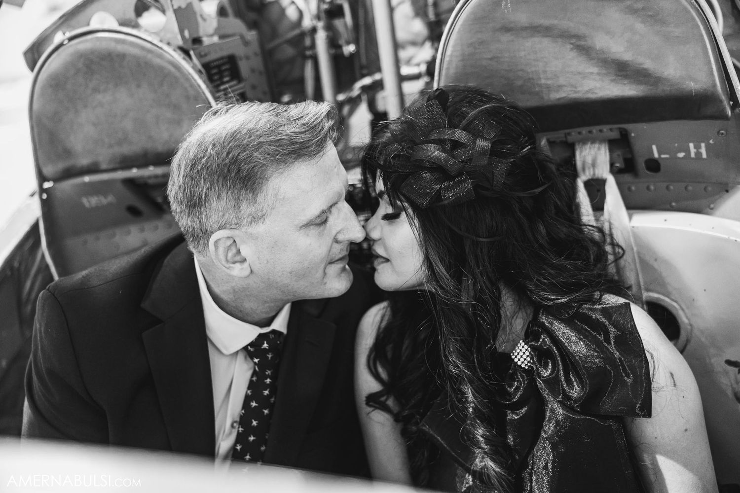 Romantic couple sharing an intimate moment in black and white photography.