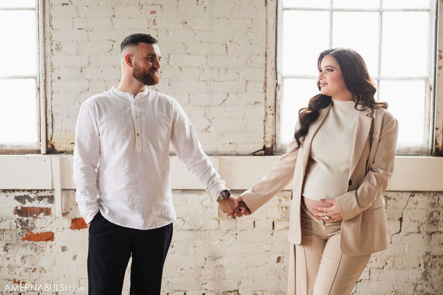 couples intimate photo holding hands at the Millworks Creative studios in Dundas Ontario.