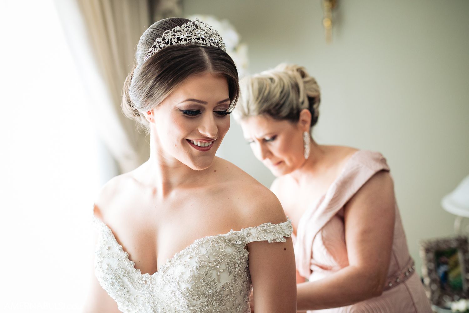 Bridal preparations with white wedding dress and delicate lace details.